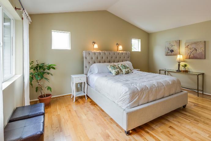 tufted white upholstered bed